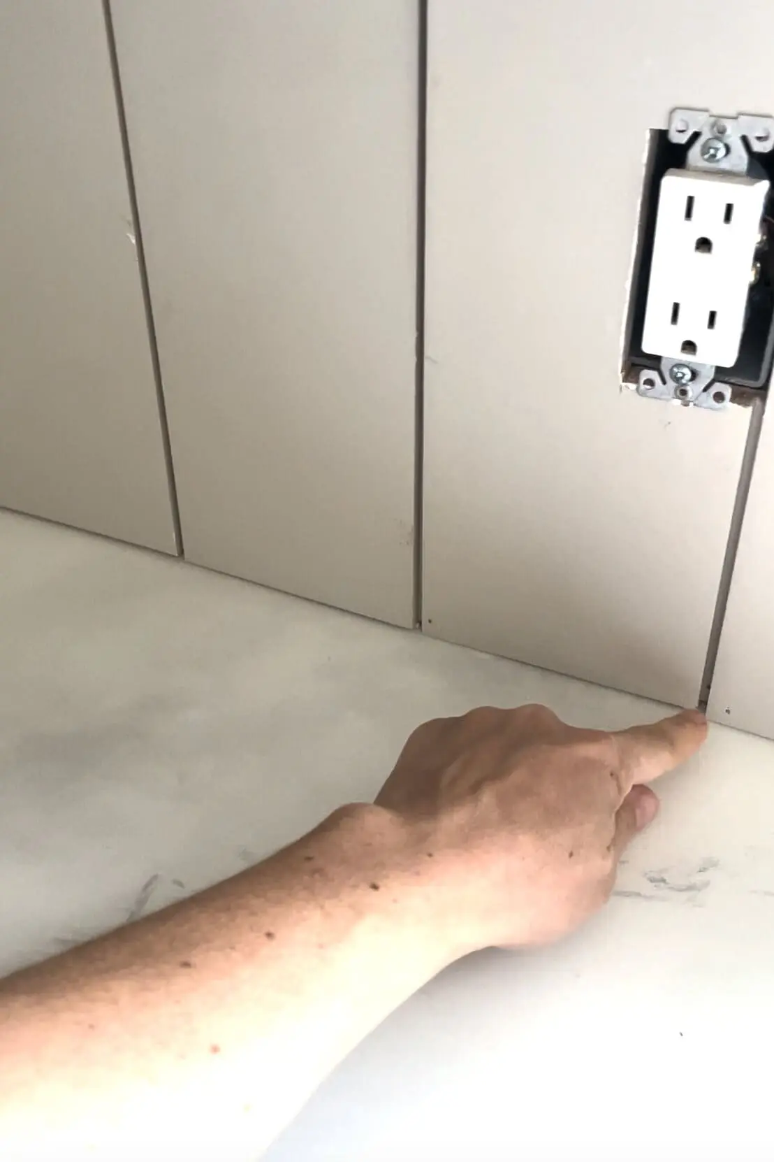 Shiplap backsplash on epoxy faux marble countertops.